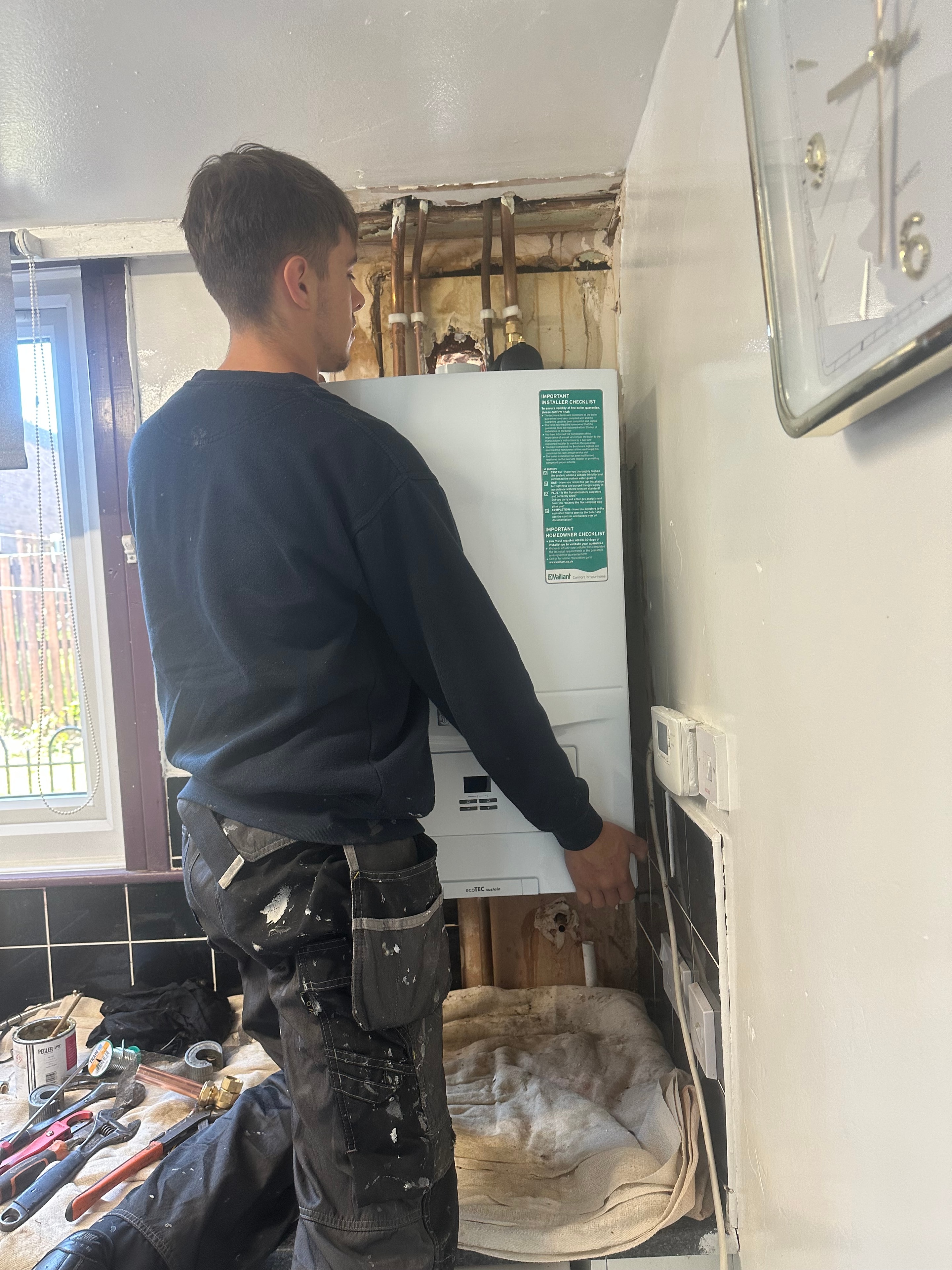 Engineer installing a new boiler